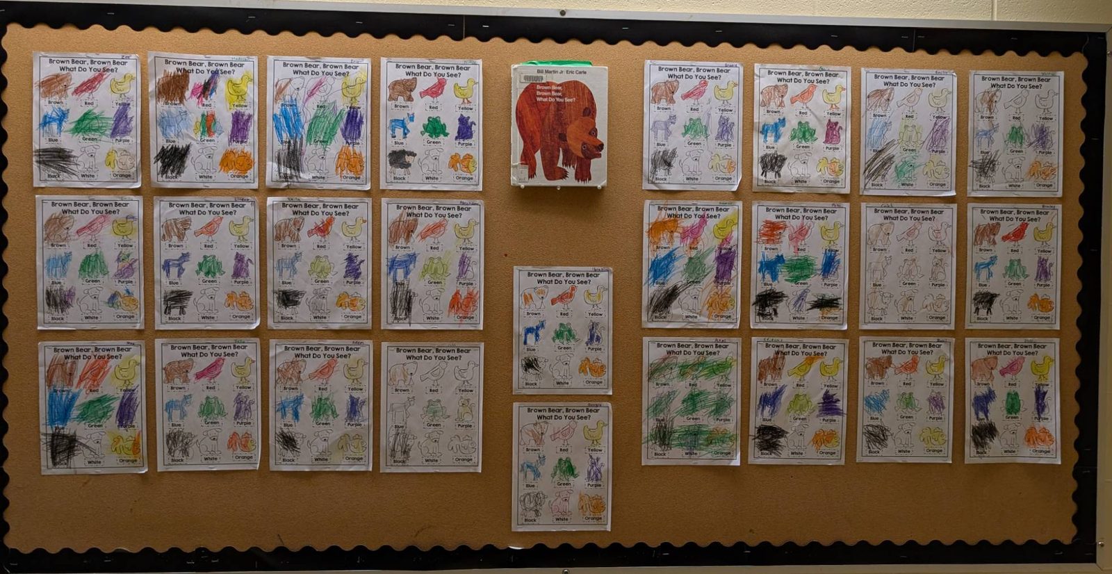 Rows of colouring sheets inspired by the picture book, each animal coloured in crayon